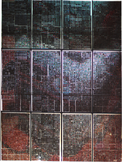 Photograph of finished MegaPixel image, showing a tin robot, made entirely from red, green and blue coloured sections.